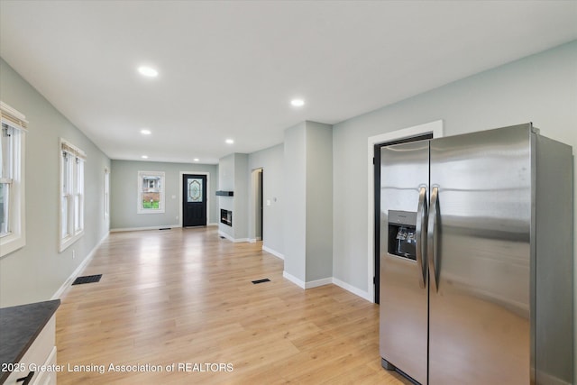 2506 W Kalamazoo St, Lansing, MI 48917 - kitchen featuring stainless steel fridge, light wood finished floors, recessed lighting, baseboards, and open floor plan