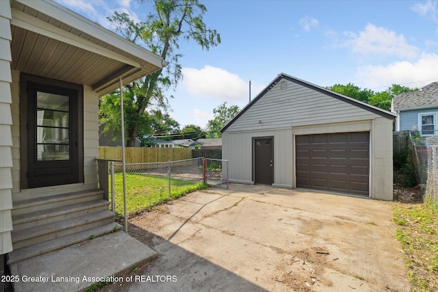 2506 W Kalamazoo St, Lansing, MI 48917 - detached garage featuring concrete driveway