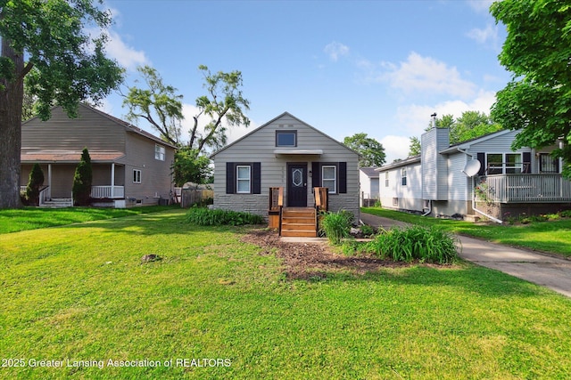 2506 W Kalamazoo St, Lansing, MI 48917 - view of front of property with a front lawn