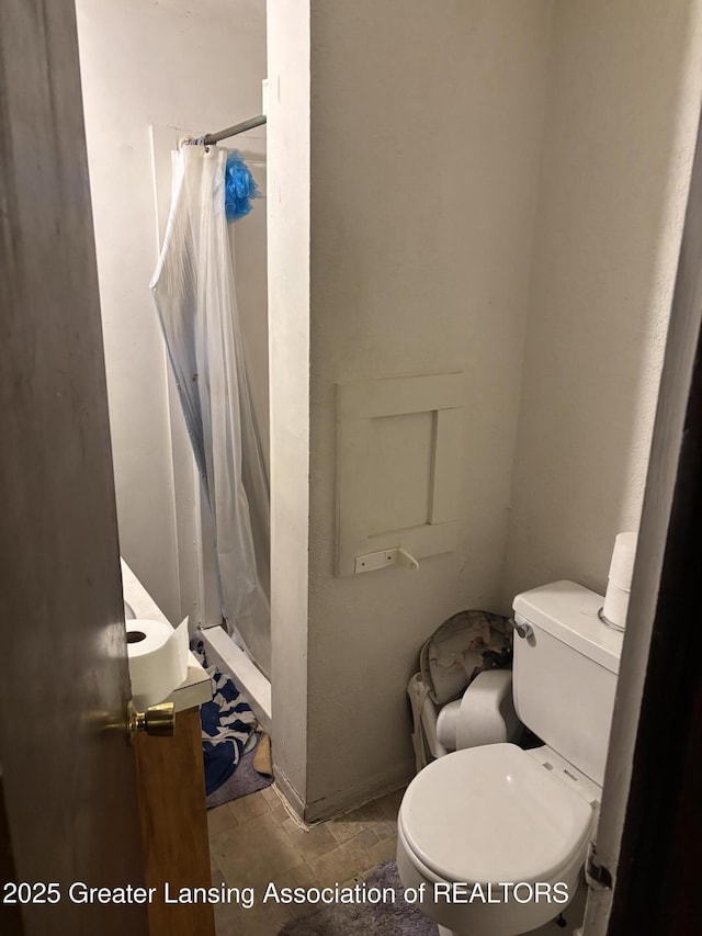 917 E Kalamazoo St, Lansing, MI 48912 - full bathroom with a stall shower, toilet, and vanity