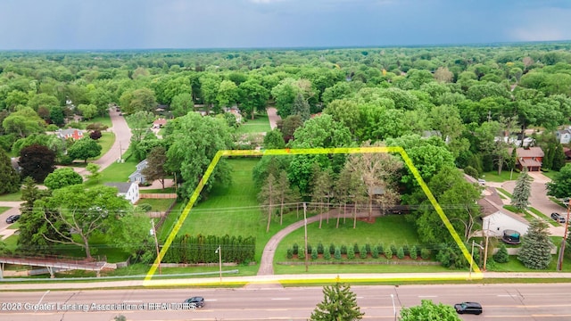 753 E Saginaw St, East Lansing, MI 48823 - aerial view of property and surrounding area with property parcel outlined and a forest