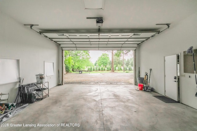 753 E Saginaw St, East Lansing, MI 48823 - garage featuring a garage door opener