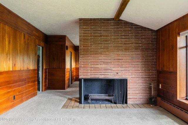 753 E Saginaw St, East Lansing, MI 48823 - detailed view of a baseboard radiator, wooden walls, carpet, a multi sided fireplace, and beamed ceiling