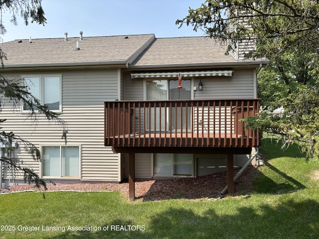 411 White Pine Blvd Unit 34, Lansing, MI 48917 - back of property featuring a deck, a lawn, and roof with shingles