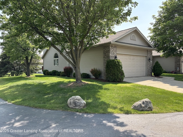 411 White Pine Blvd Unit 34, Lansing, MI 48917 - view of front facade with an attached garage, driveway, a front lawn, and brick siding