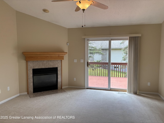 411 White Pine Blvd Unit 34, Lansing, MI 48917 - unfurnished living room with carpet floors, ceiling fan, and a tile fireplace