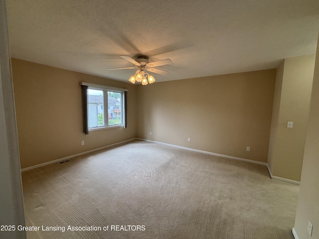 411 White Pine Blvd Unit 34, Lansing, MI 48917 - spare room featuring ceiling fan, light colored carpet, and a textured ceiling