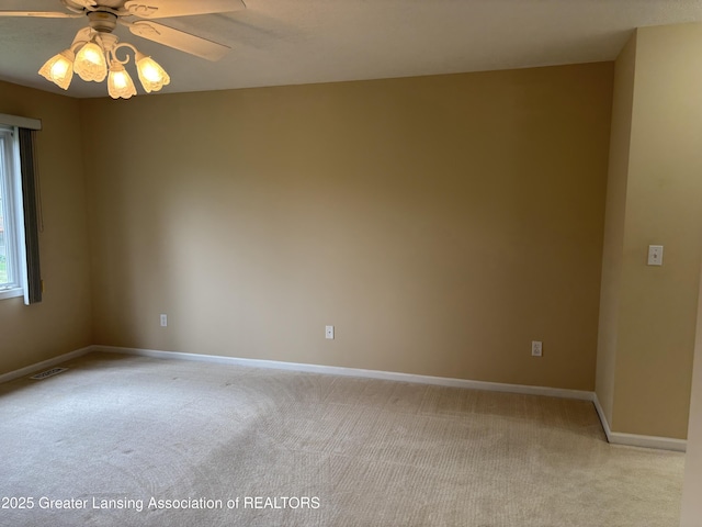 411 White Pine Blvd Unit 34, Lansing, MI 48917 - carpeted spare room featuring baseboards and a ceiling fan