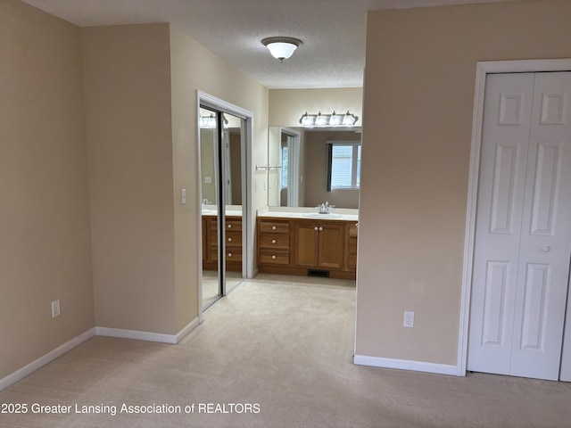 411 White Pine Blvd Unit 34, Lansing, MI 48917 - bathroom featuring vanity and a textured ceiling