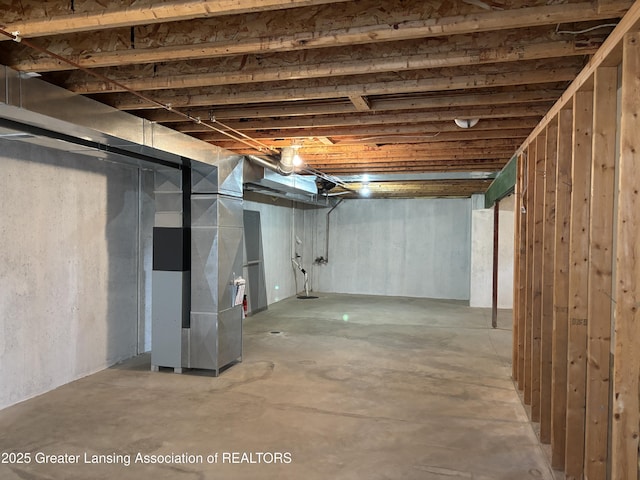 411 White Pine Blvd Unit 34, Lansing, MI 48917 - unfinished basement with heating unit