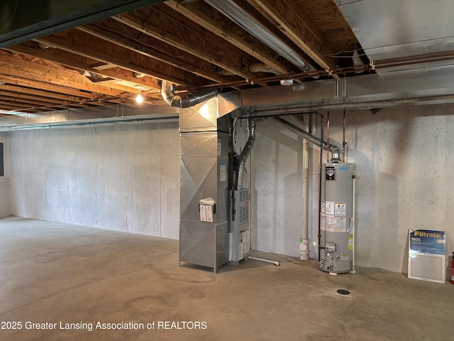 411 White Pine Blvd Unit 34, Lansing, MI 48917 - unfinished below grade area featuring gas water heater, heating unit, and electric panel