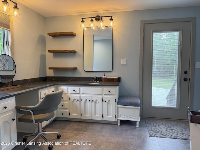12855 Oneida Woods Trl, Grand Ledge, MI 48837 - bathroom with vanity and tile patterned floors