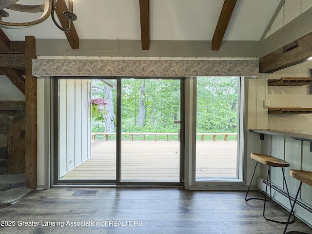 12855 Oneida Woods Trl, Grand Ledge, MI 48837 - doorway featuring a baseboard radiator, beamed ceiling, and wood finished floors