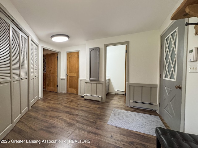 12855 Oneida Woods Trl, Grand Ledge, MI 48837 - entryway featuring a baseboard radiator, dark wood-style floors, and baseboards