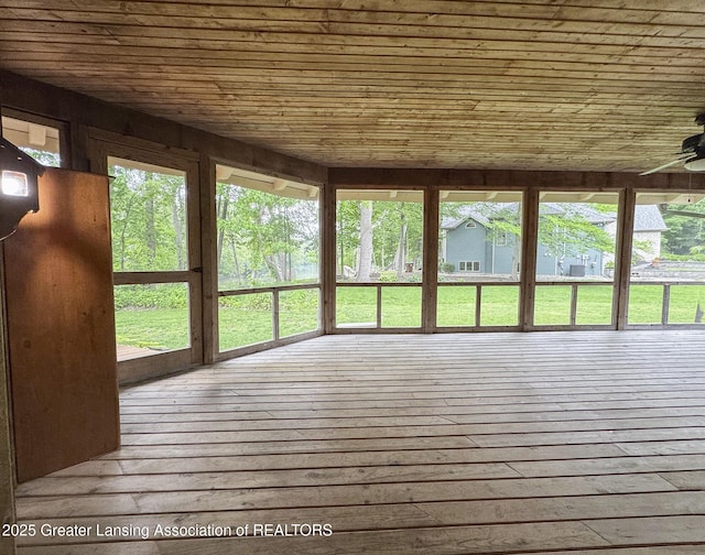 12855 Oneida Woods Trl, Grand Ledge, MI 48837 - unfurnished sunroom featuring wood ceiling, plenty of natural light, and a wooden deck