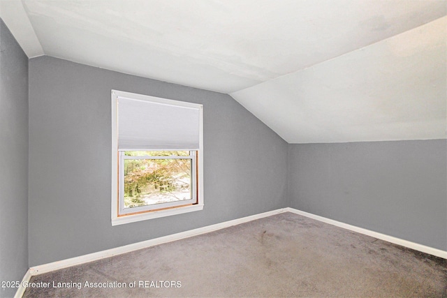 131 W S St, Williamston, MI 48895 - bonus room with lofted ceiling, carpet, and baseboards
