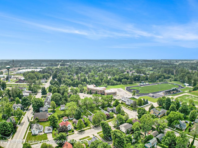 131 W S St, Williamston, MI 48895 - aerial view of residential area featuring a tree filled landscape