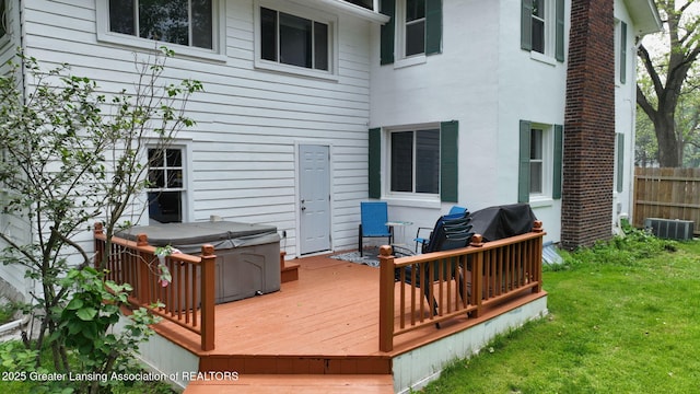 627 State St, Eaton Rapids, MI 48827 - deck featuring a hot tub and central AC