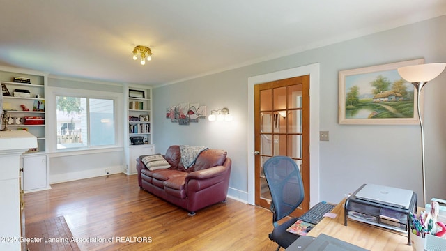 627 State St, Eaton Rapids, MI 48827 - home office featuring wood finished floors and baseboards