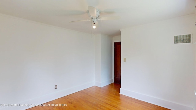 627 State St, Eaton Rapids, MI 48827 - empty room with a ceiling fan, light wood-type flooring, and baseboards