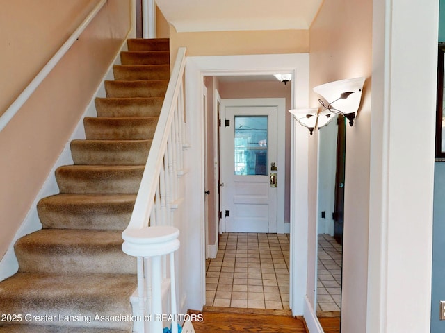 627 State St, Eaton Rapids, MI 48827 - stairs featuring tile patterned flooring