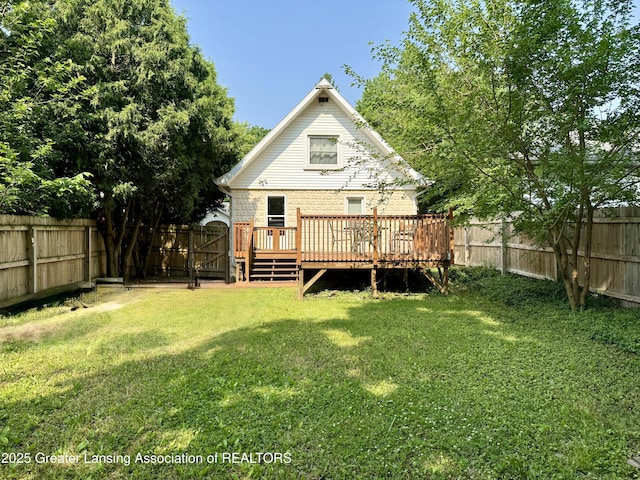 227 S Foster Ave, Lansing, MI 48912 - back of property featuring a wooden deck and brick siding