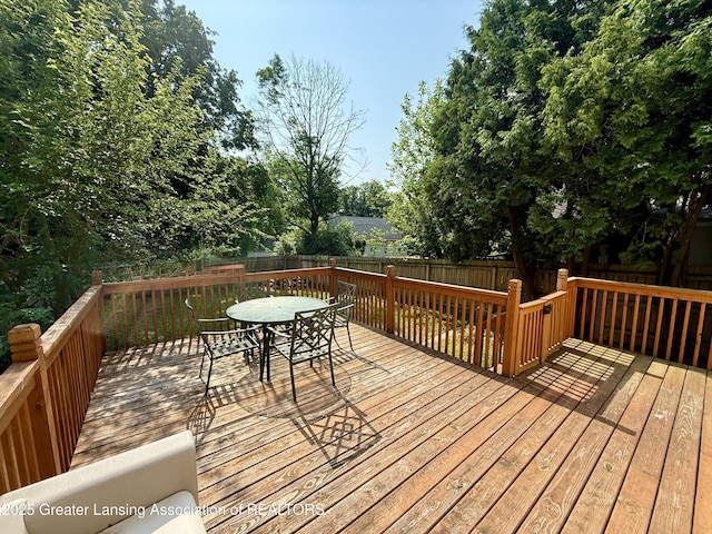 227 S Foster Ave, Lansing, MI 48912 - deck with a fenced backyard and outdoor dining area