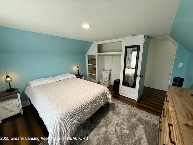 227 S Foster Ave, Lansing, MI 48912 - bedroom featuring a closet, wood finished floors, lofted ceiling, baseboards, and recessed lighting