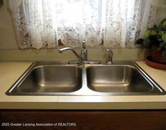 4818 Moultrie Cir, Lansing, MI 48917 - kitchen view of a sink and light countertops