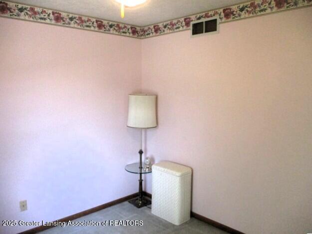 4818 Moultrie Cir, Lansing, MI 48917 - unfurnished room featuring baseboards