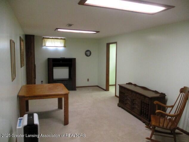 4818 Moultrie Cir, Lansing, MI 48917 - sitting room with light colored carpet