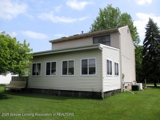 4818 Moultrie Cir, Lansing, MI 48917 - view of side of property featuring a lawn
