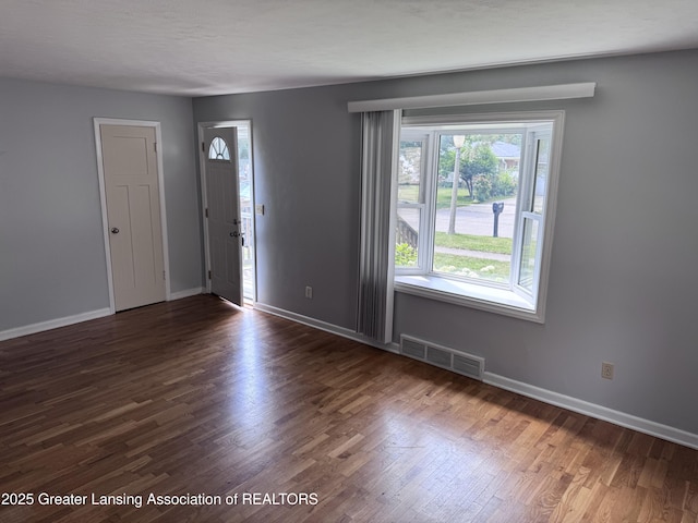 603 Armstrong Rd, Lansing, MI 48911 - entrance foyer featuring plenty of natural light and wood finished floors