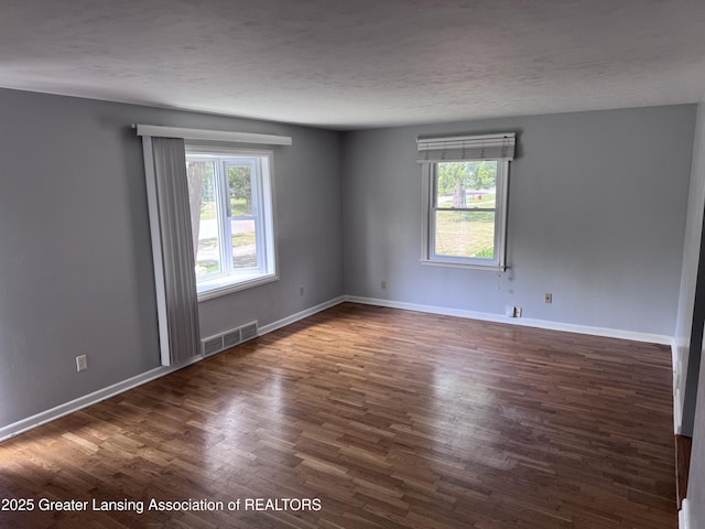 603 Armstrong Rd, Lansing, MI 48911 - spare room with healthy amount of natural light and wood finished floors