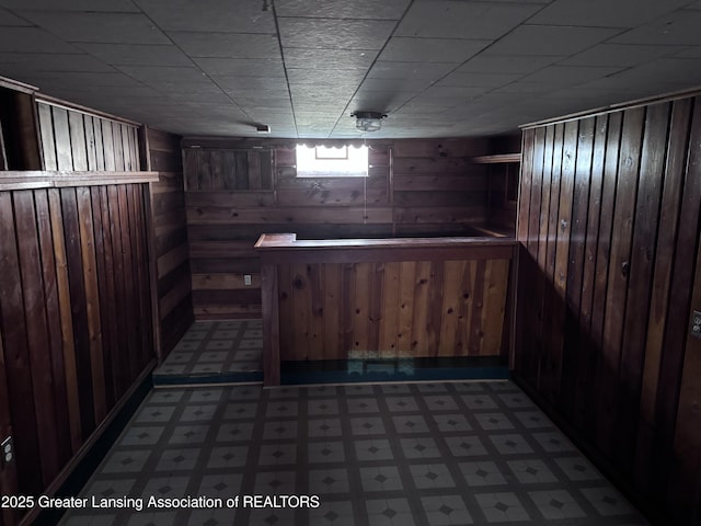 603 Armstrong Rd, Lansing, MI 48911 - indoor dry bar with tile patterned floors and wood walls