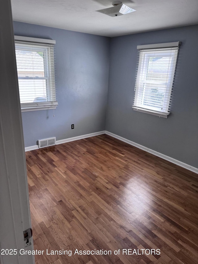 603 Armstrong Rd, Lansing, MI 48911 - empty room with dark wood-type flooring