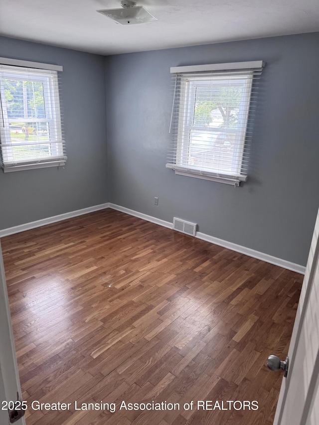 603 Armstrong Rd, Lansing, MI 48911 - unfurnished room with wood finished floors and a ceiling fan