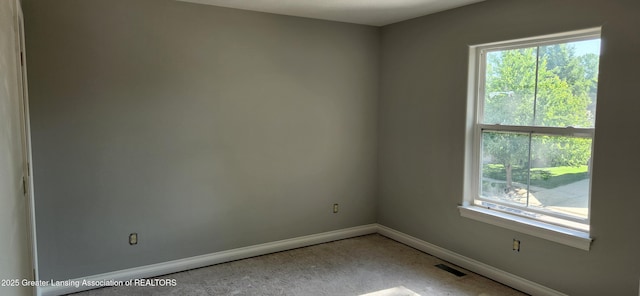 7822 Forestview Dr, Haslett, MI 48840 - empty room with baseboards and light carpet