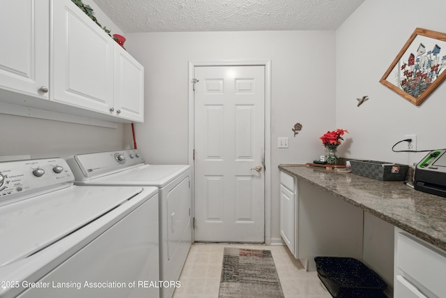 1703 Willow Creek Dr Unit 29, Lansing, MI 48917 - washroom with cabinet space, washing machine and clothes dryer, and a textured ceiling