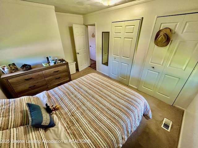 3130 Delta River Dr, Lansing, MI 48906 - carpeted bedroom with ornamental molding