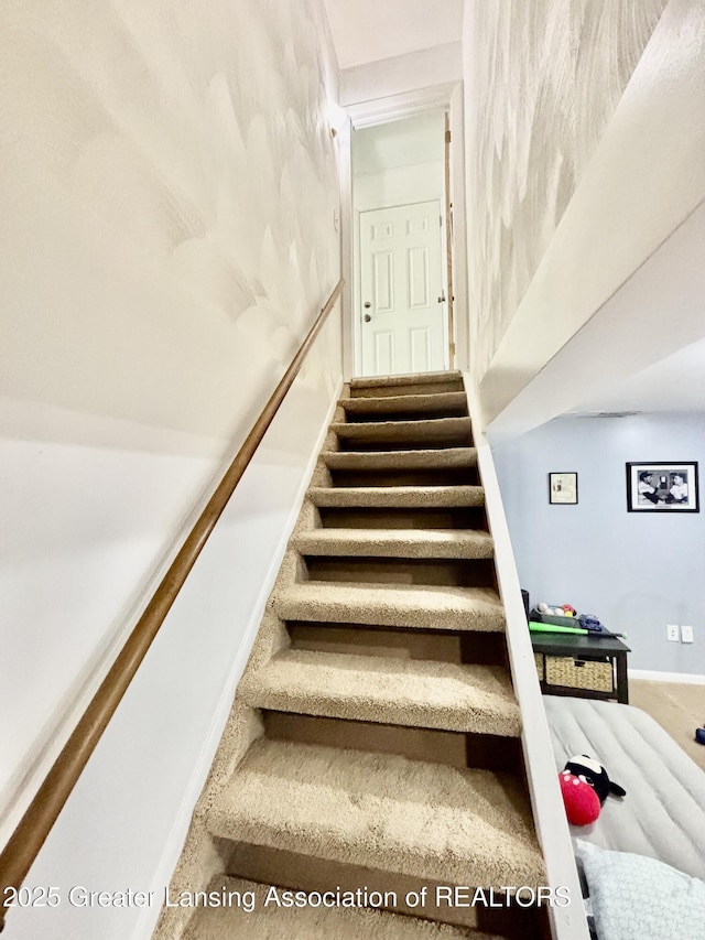 3130 Delta River Dr, Lansing, MI 48906 - staircase featuring baseboards