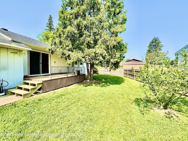 3130 Delta River Dr, Lansing, MI 48906 - view of yard featuring a wooden deck