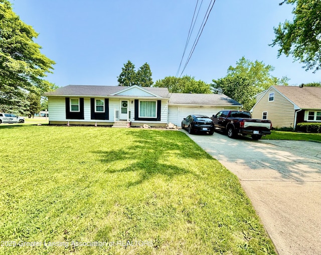 3130 Delta River Dr, Lansing, MI 48906 - ranch-style home with driveway, a garage, and a front yard