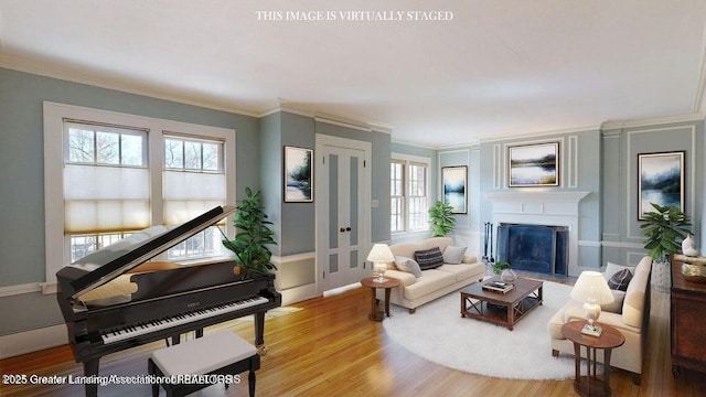 1046 Cresenwood Rd, East Lansing, MI 48823 - living room with wood finished floors, ornamental molding, and a fireplace with flush hearth