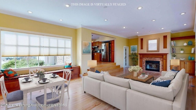 1046 Cresenwood Rd, East Lansing, MI 48823 - living room with ornamental molding, recessed lighting, light wood-type flooring, and a glass covered fireplace