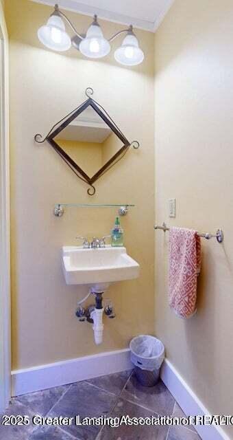 1046 Cresenwood Rd, East Lansing, MI 48823 - bathroom with baseboards and tile patterned flooring