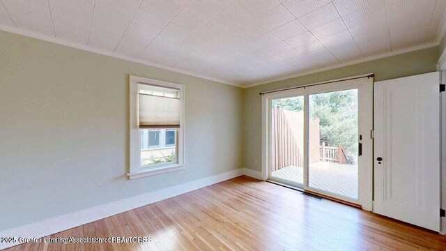 1046 Cresenwood Rd, East Lansing, MI 48823 - unfurnished room featuring ornamental molding and wood finished floors