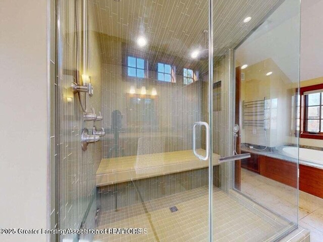 1046 Cresenwood Rd, East Lansing, MI 48823 - bathroom with a shower stall, a bath, tile patterned flooring, and recessed lighting