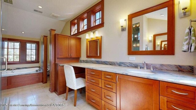1046 Cresenwood Rd, East Lansing, MI 48823 - full bath featuring vanity, a bath, vaulted ceiling, recessed lighting, and tile patterned flooring