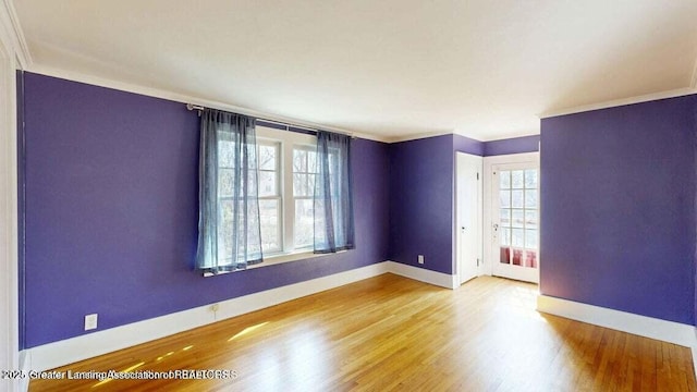 1046 Cresenwood Rd, East Lansing, MI 48823 - spare room with wood finished floors and ornamental molding